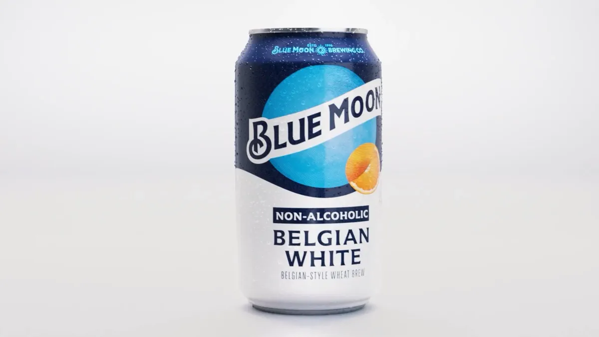 A Blue Moon Belgian White can rotates against a clean white background