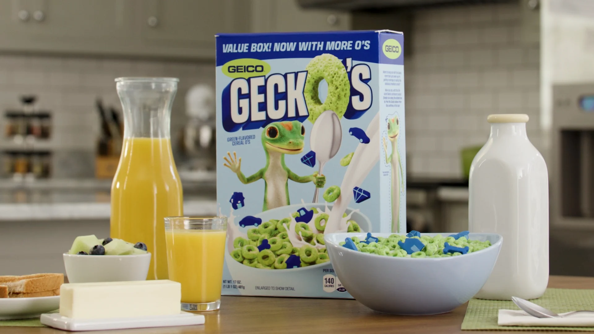 Real printed GeckO's cereal box among breakfast props, photographed as lighting and framing reference.
